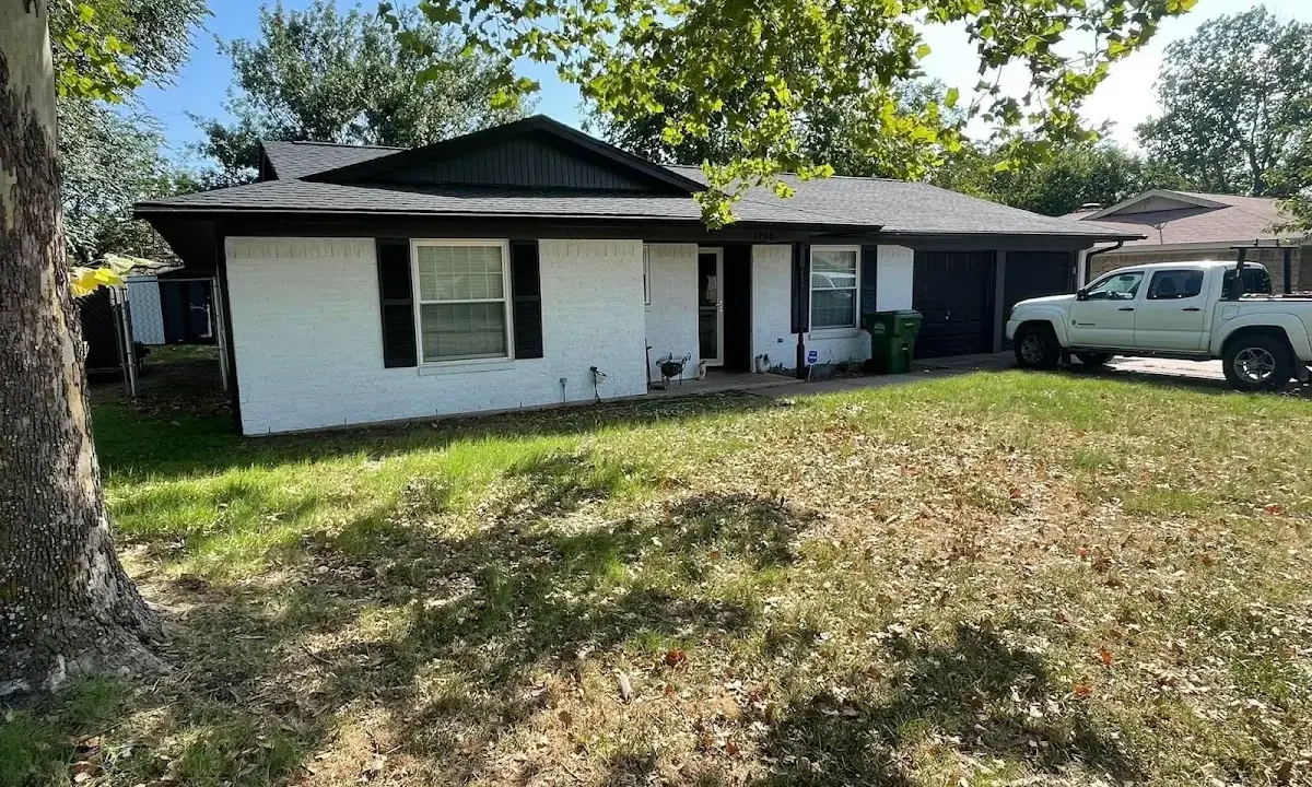 Professional roofing crew working on a residential roof in Royal Oak